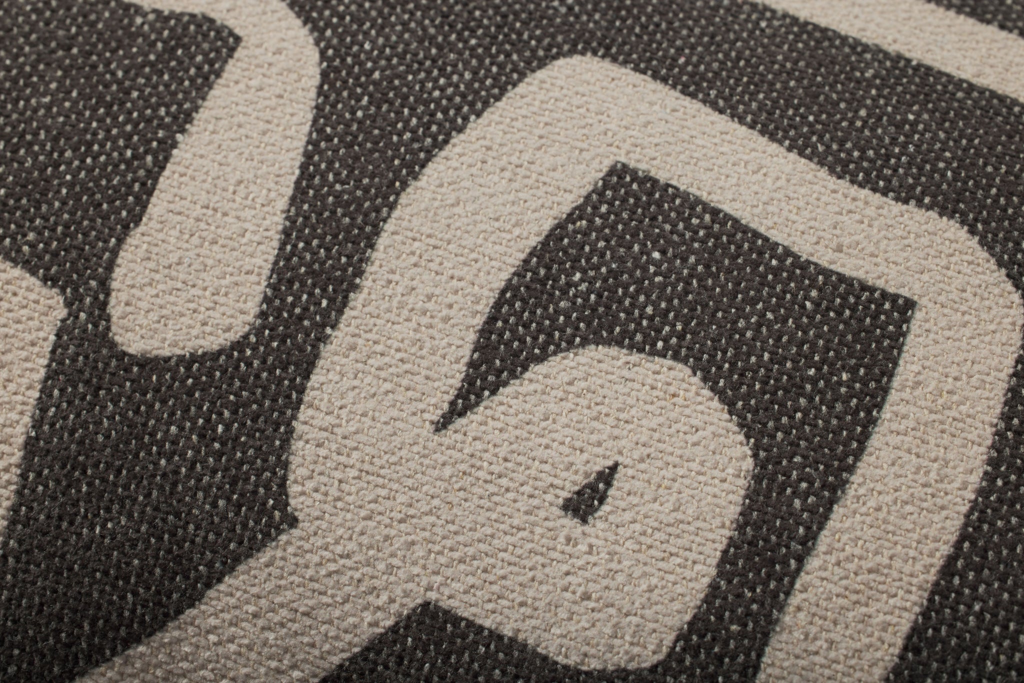 Charcoal / Natural Pillow (Pattern 1) shown from a different angle to reveal its pattern.
