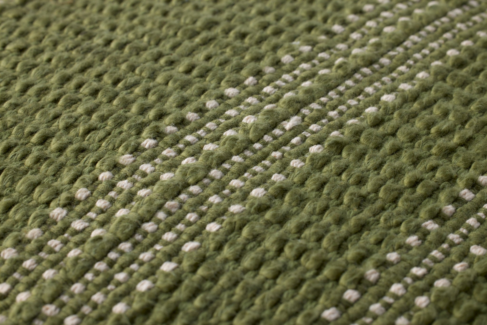 Green / Ivory Pillow (Pattern 2) shown from a different angle to reveal its pattern.