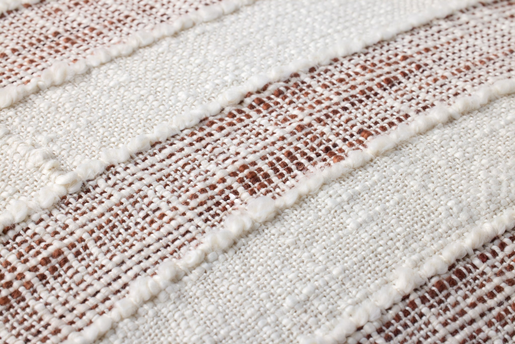 Rust / Ivory Pillow shown from a different angle to reveal its pattern.