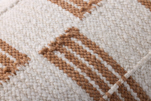 Rust / Ivory Pillow (Pattern 2) shown from a different angle to reveal its pattern.