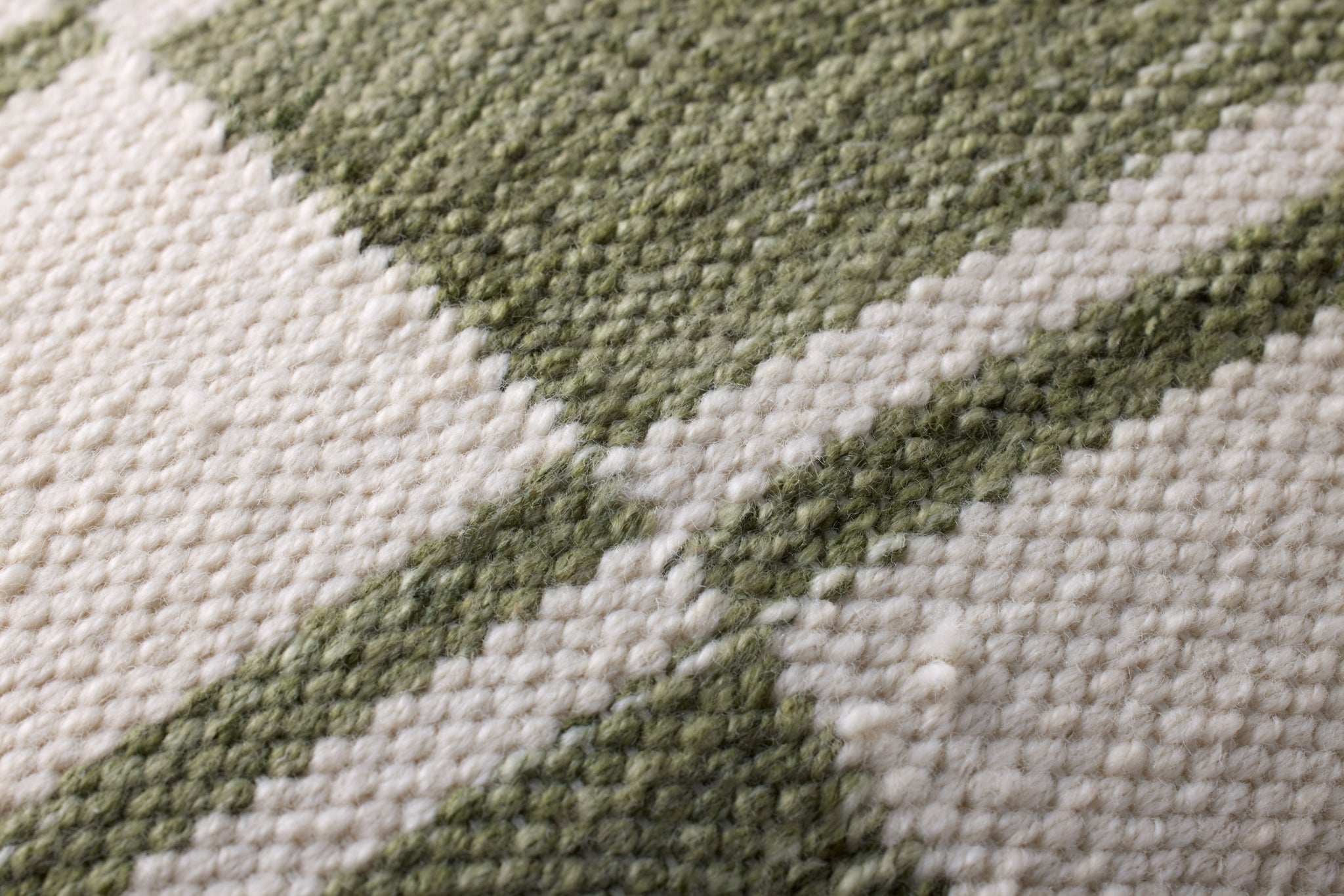 Ivory / Green Pillow (Pattern 3) shown from a different angle to reveal its pattern.