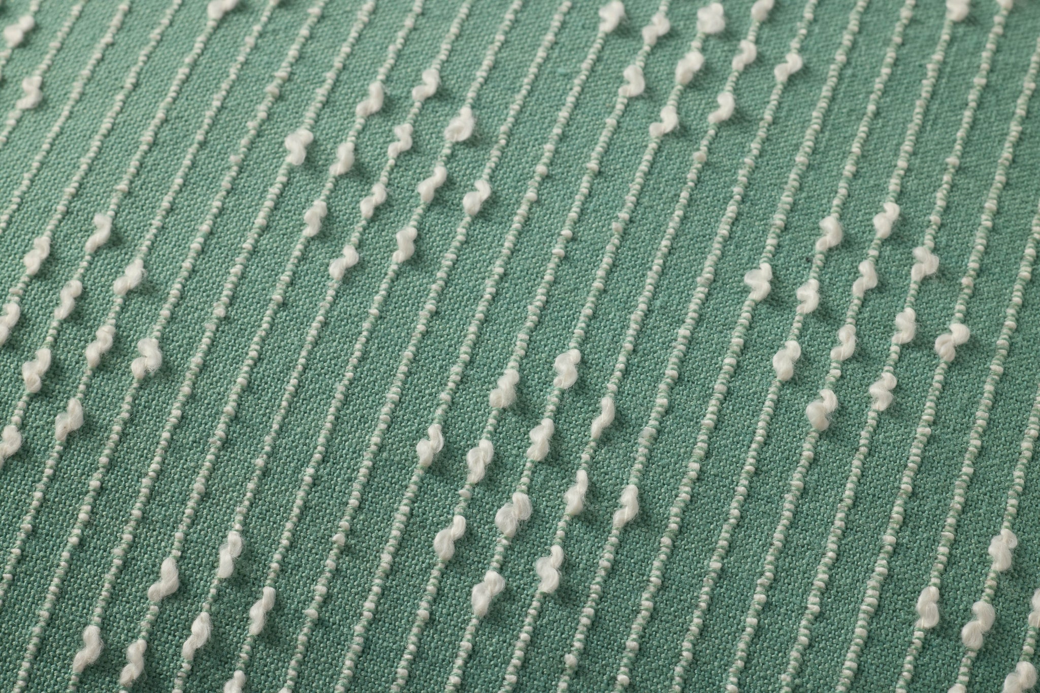 Aqua Pillow shown from a different angle to reveal its pattern.