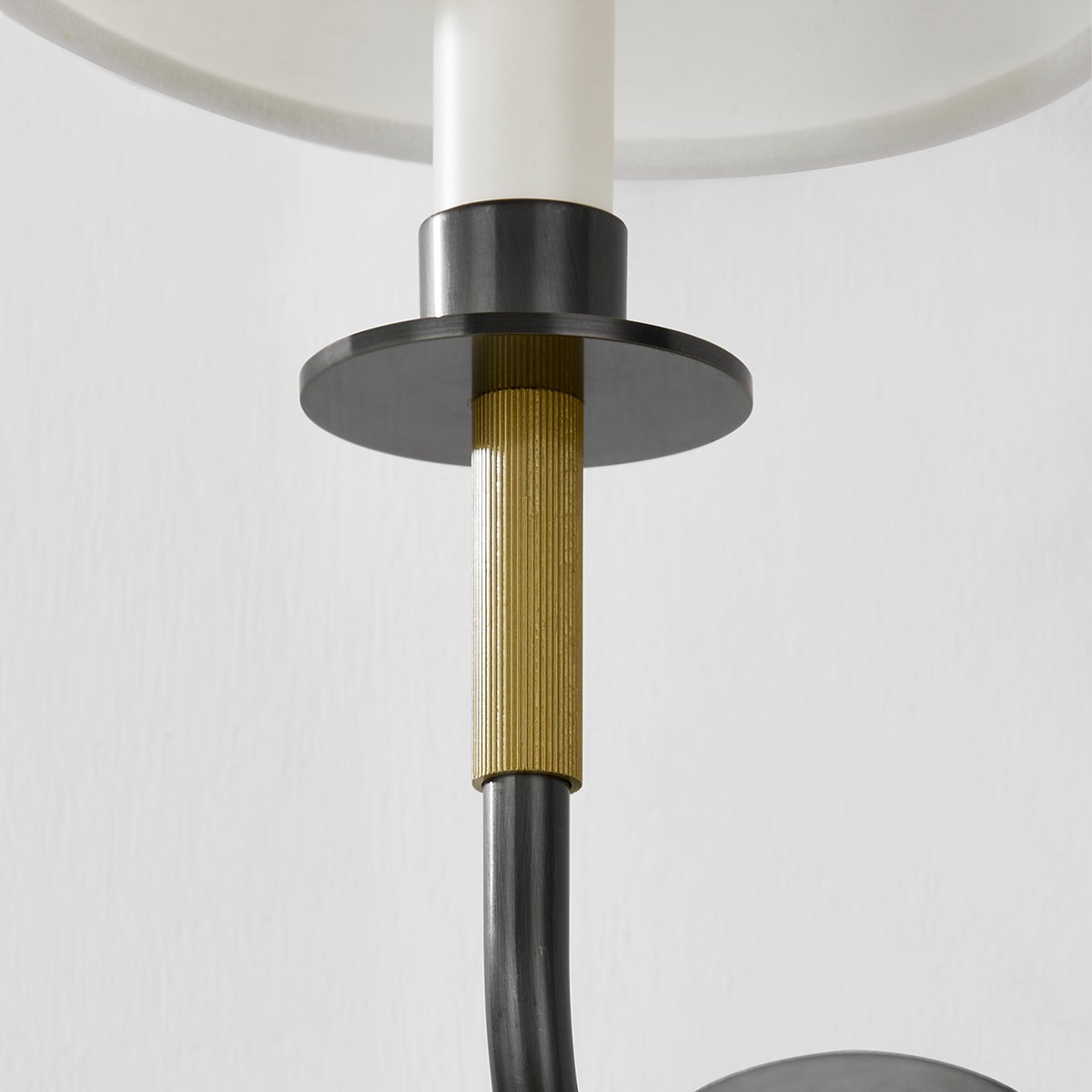 Close-up of the Paramus Wall Sconce showing the arm curve and shade silhouette.