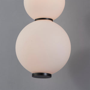 Close-up of the Perrin Wall Sconce showing the arm curve and shade silhouette.
