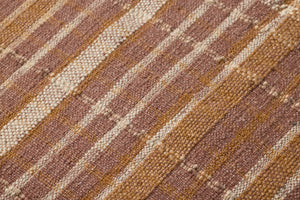 Wallace Clay Clay Pouf shown from a different angle to reveal its pattern.