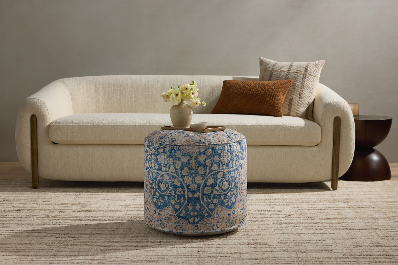 Blue / Tangerine Pouf — a Loloi pouf at Laurie Yapp Home.