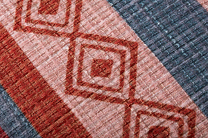Poufs Red / Pink shown from a different angle to reveal its pattern.