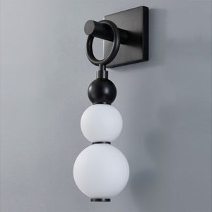 Close-up of the Perrin Wall Sconce showing the arm curve and shade silhouette.