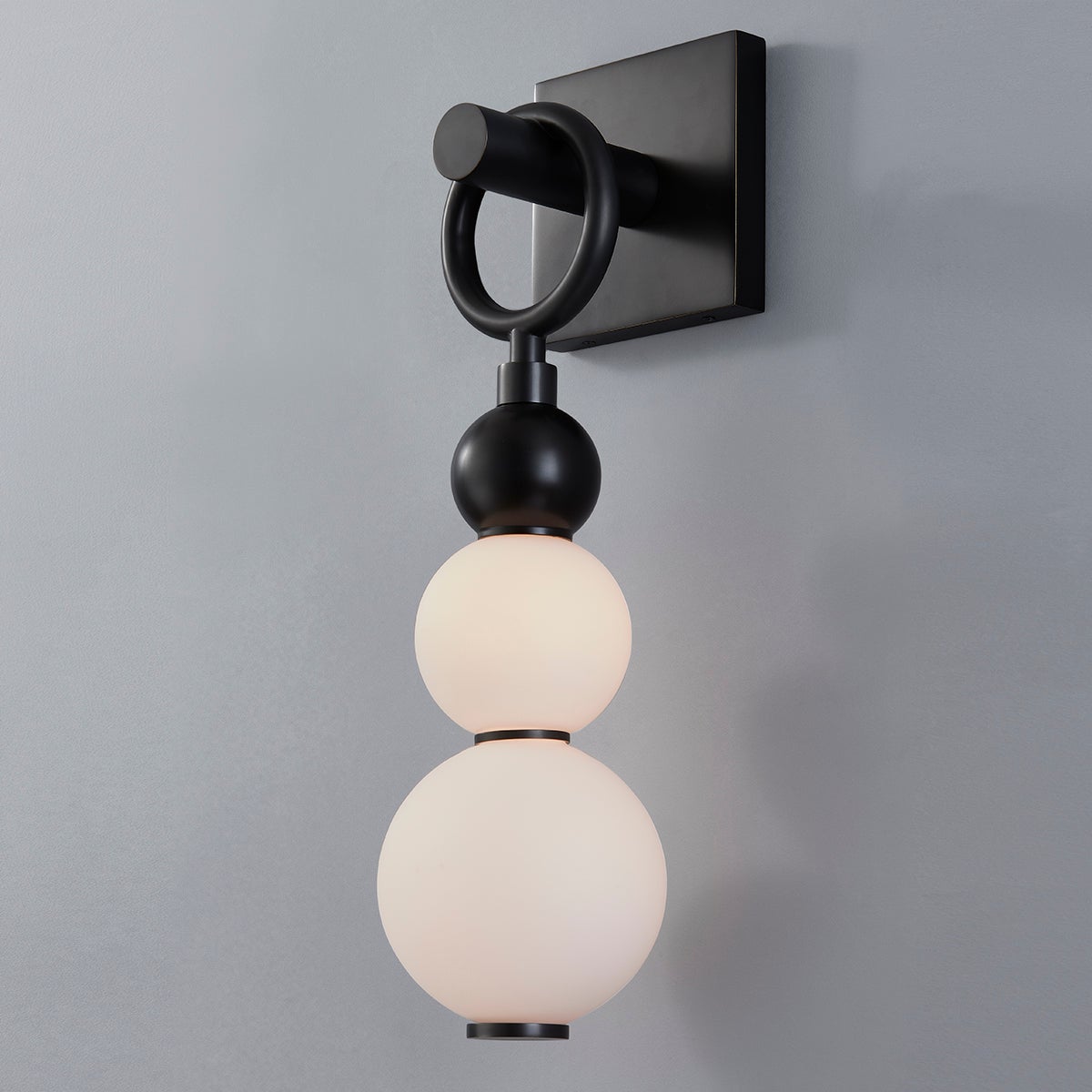 Close-up of the Perrin Wall Sconce showing the arm curve and shade silhouette.