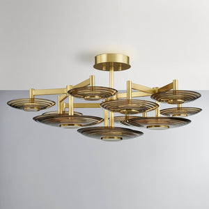 Griston Semi Flush 44" in aged brass shown from the front to reveal the shade profile and mounting canopy.