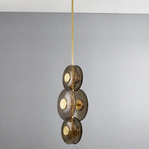 Close-up of the Griston Pendant in aged brass showing the shade shape and metal detail.
