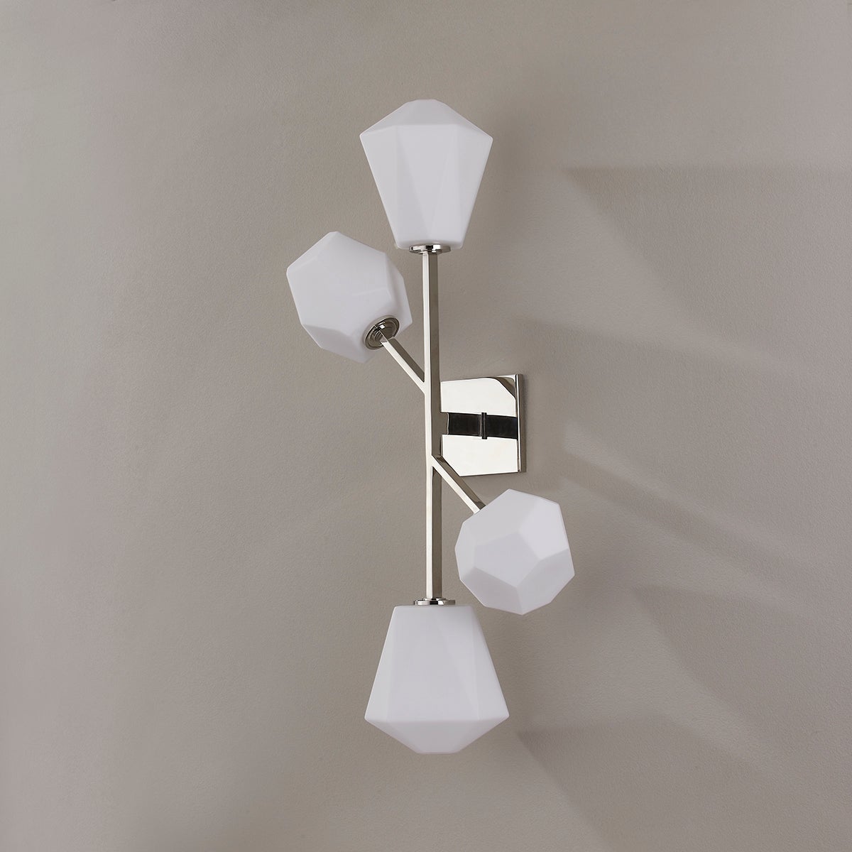 Close-up of the Tring Wall Sconce in polished nickel showing the arm curve and shade silhouette.