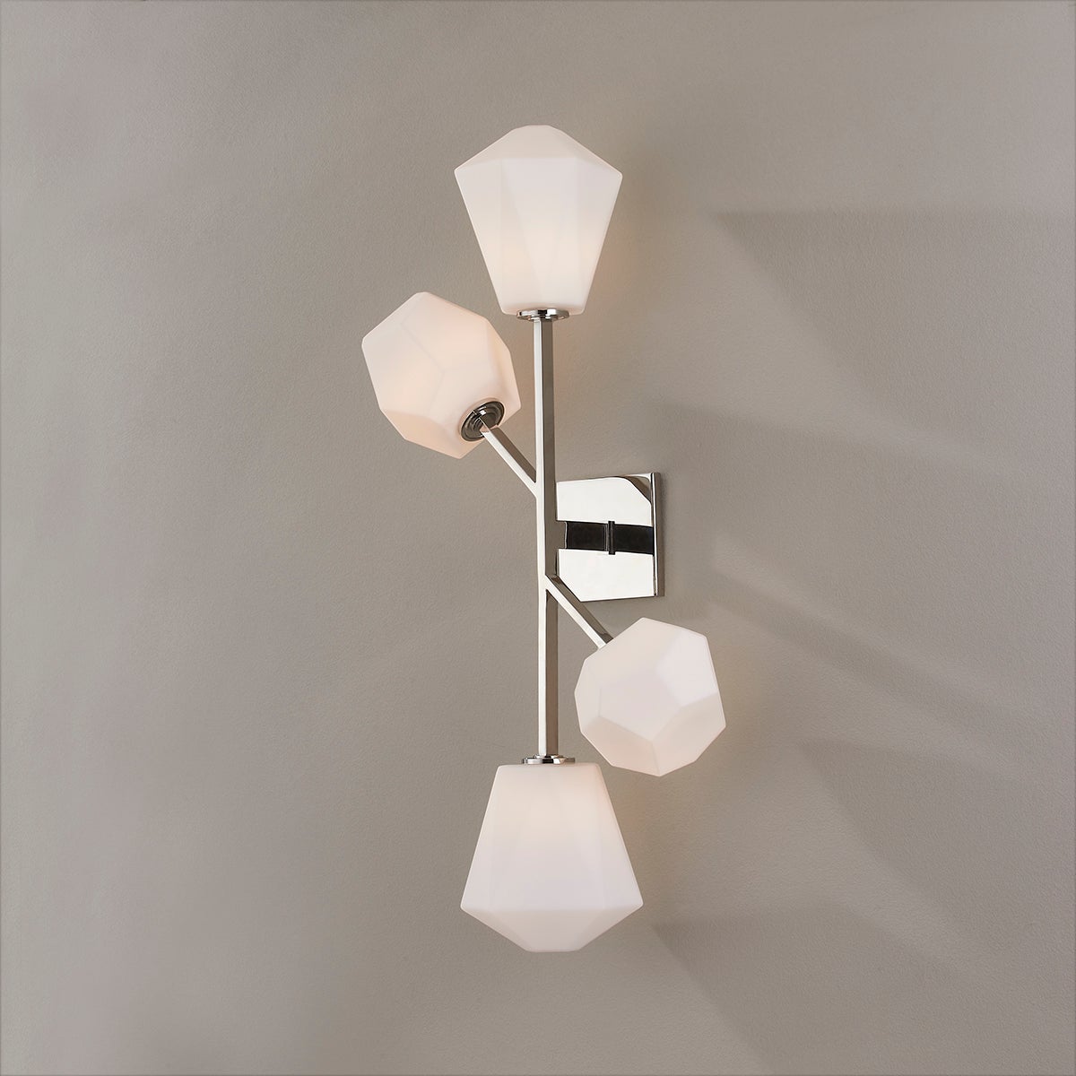 Close-up of the Tring Wall Sconce in polished nickel showing the arm curve and shade silhouette.