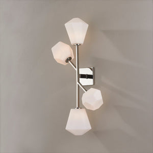 Close-up of the Tring Wall Sconce in polished nickel showing the arm curve and shade silhouette.