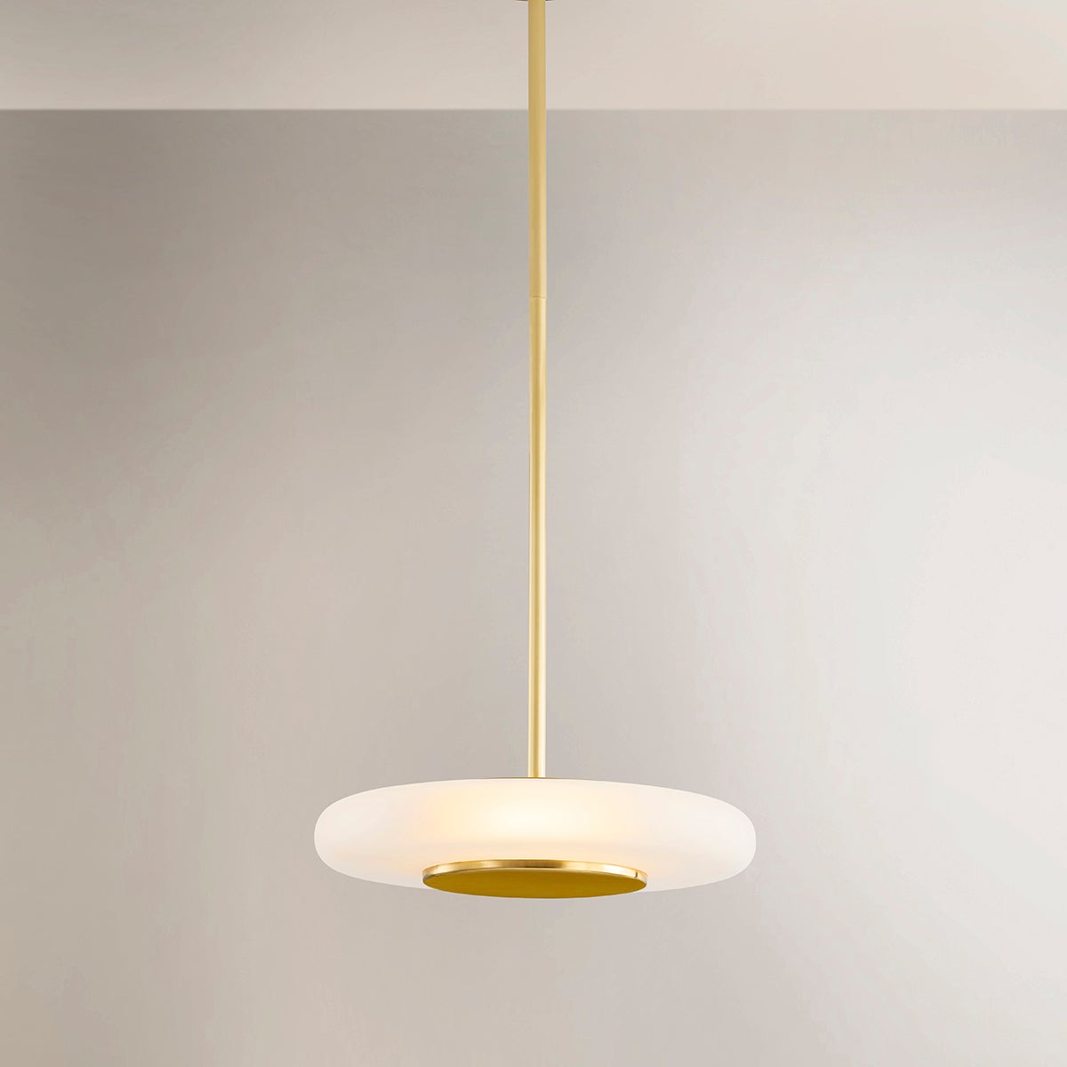 Close-up of the Blyford Pendant 15.5" in aged brass showing the shade shape and metal detail.