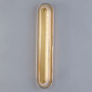 Close-up of the Litton Wall Sconce 5.75" x 28" in aged brass showing the arm curve and shade silhouette.