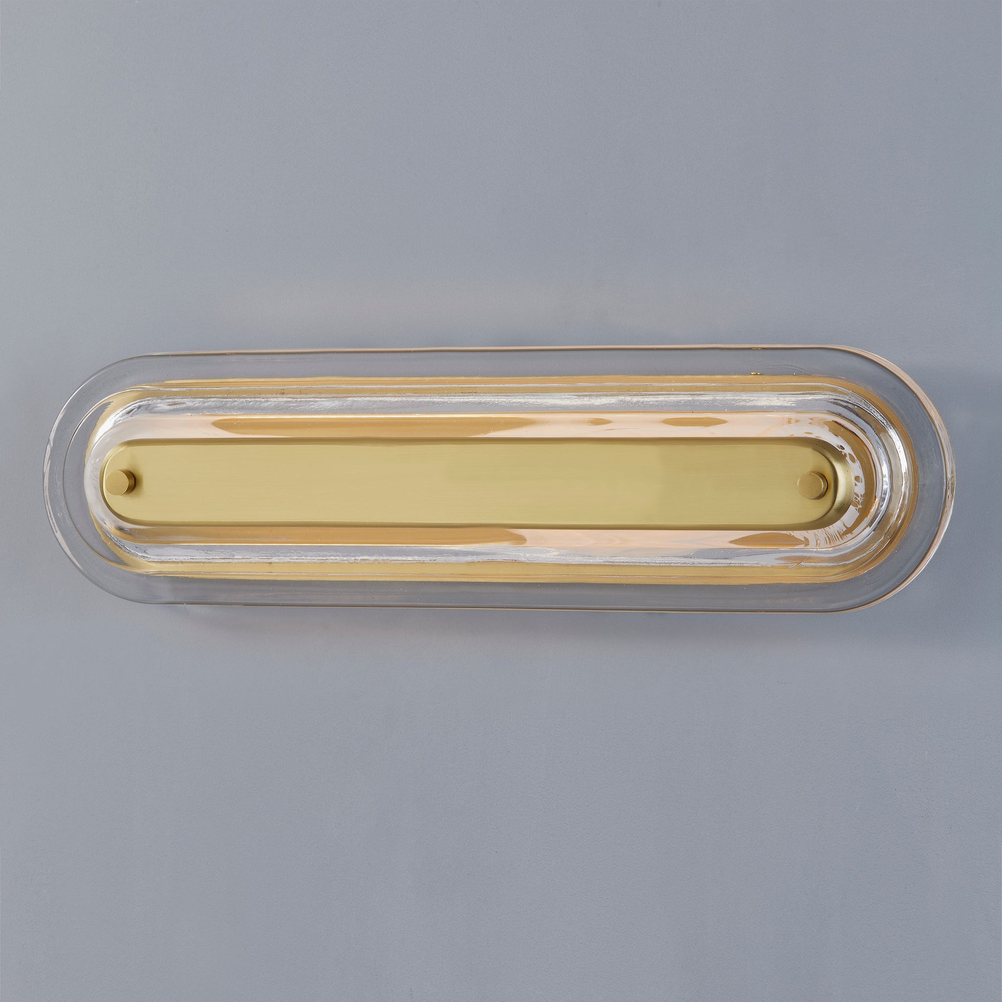 Close-up of the Litton Wall Sconce 5.75" x 21.25" in aged brass showing the arm curve and shade silhouette.