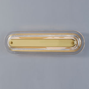 Close-up of the Litton Wall Sconce 5.75" x 21.25" in aged brass showing the arm curve and shade silhouette.