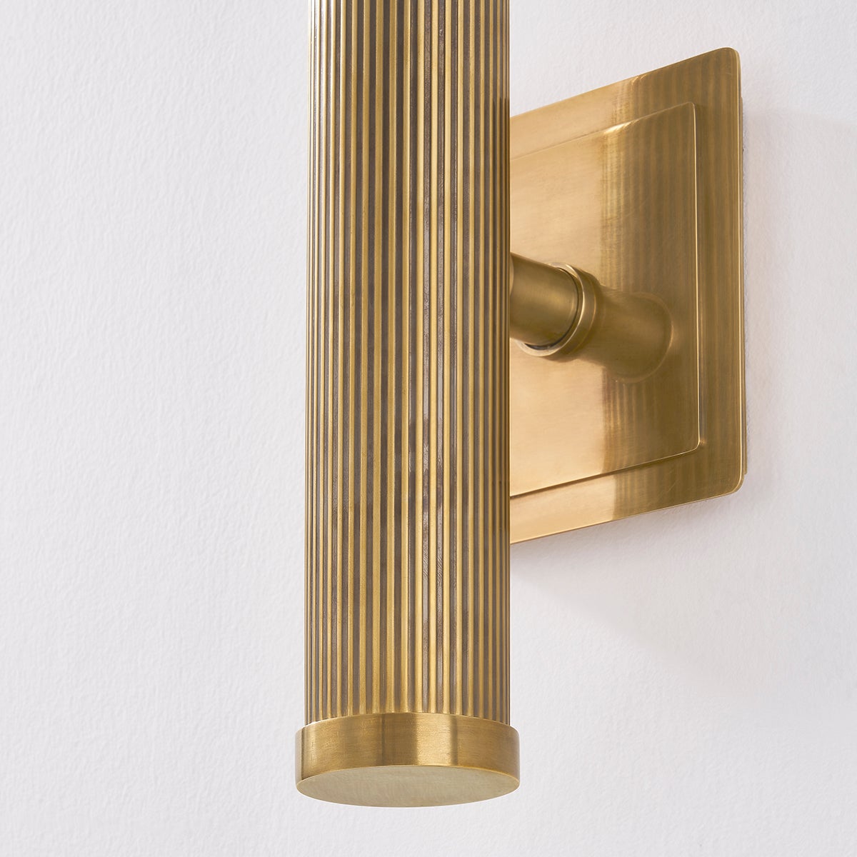 Close-up of the Pienza Wall Sconce 5.5" x 20" showing the arm curve and shade silhouette.