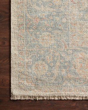 Side view of the Priya Bone / Bluestone rug.
