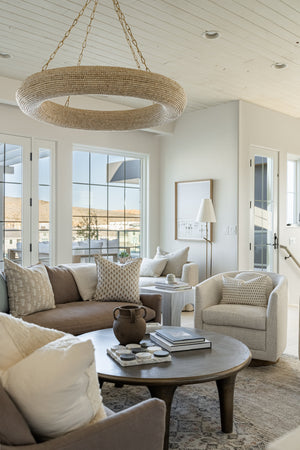Lure Chandelier 50" styled in an elegant dining room for warm, layered light at Laurie Yapp Home.
