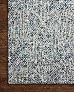 Side view of the Raven Blue / Ivory rug.