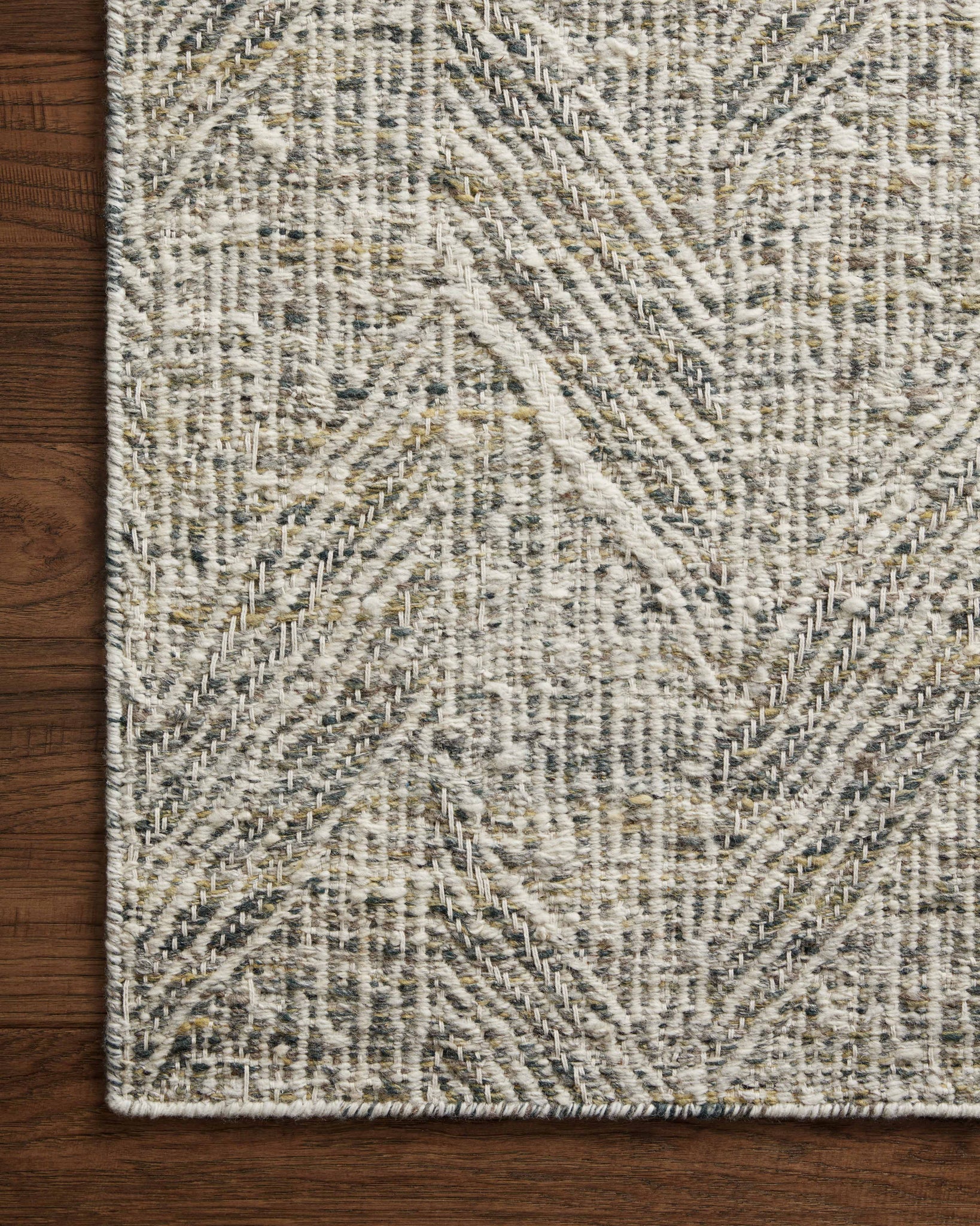 Side view of the Raven Moss / Ivory rug.