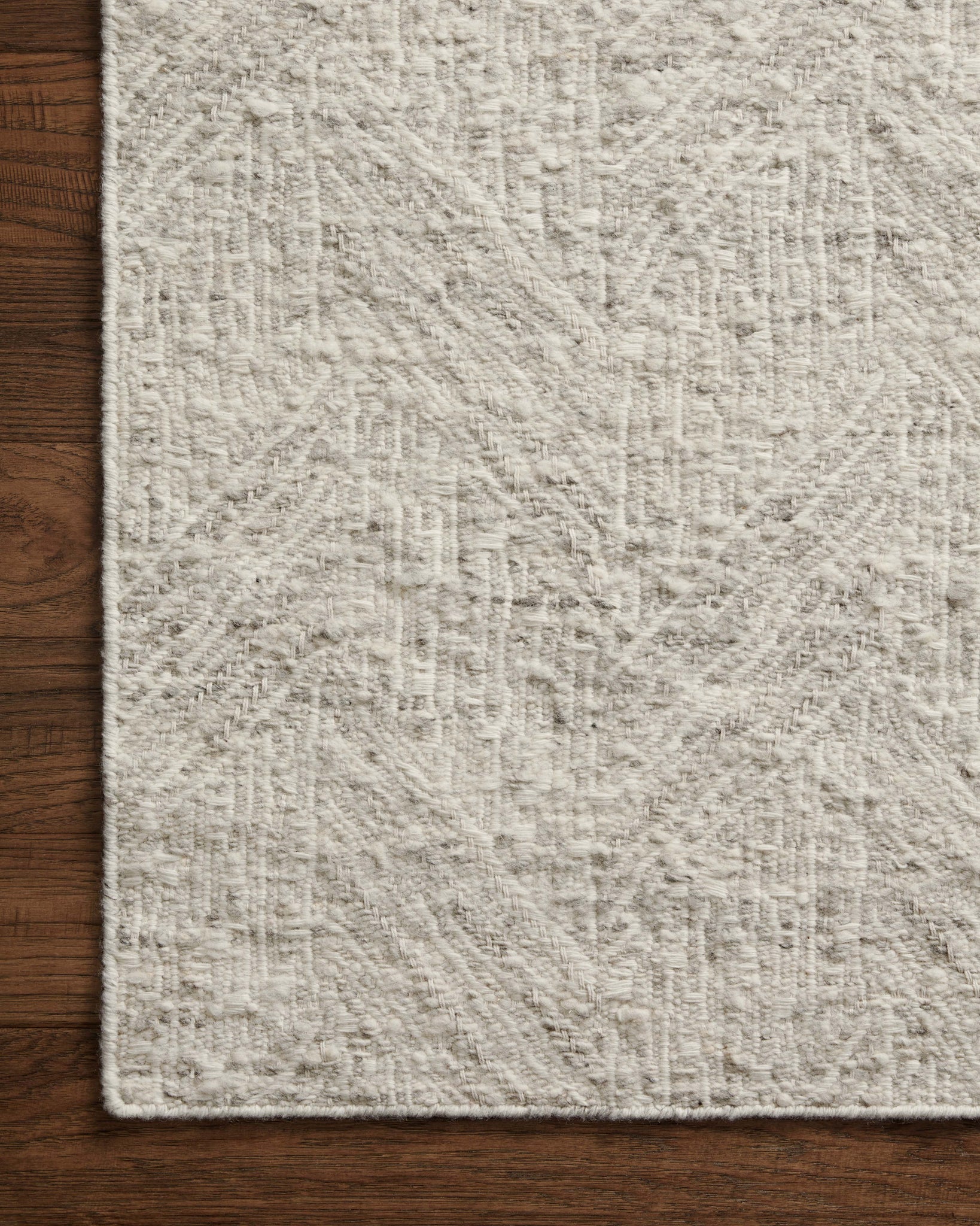 Side view of the Raven Silver / Ivory rug.