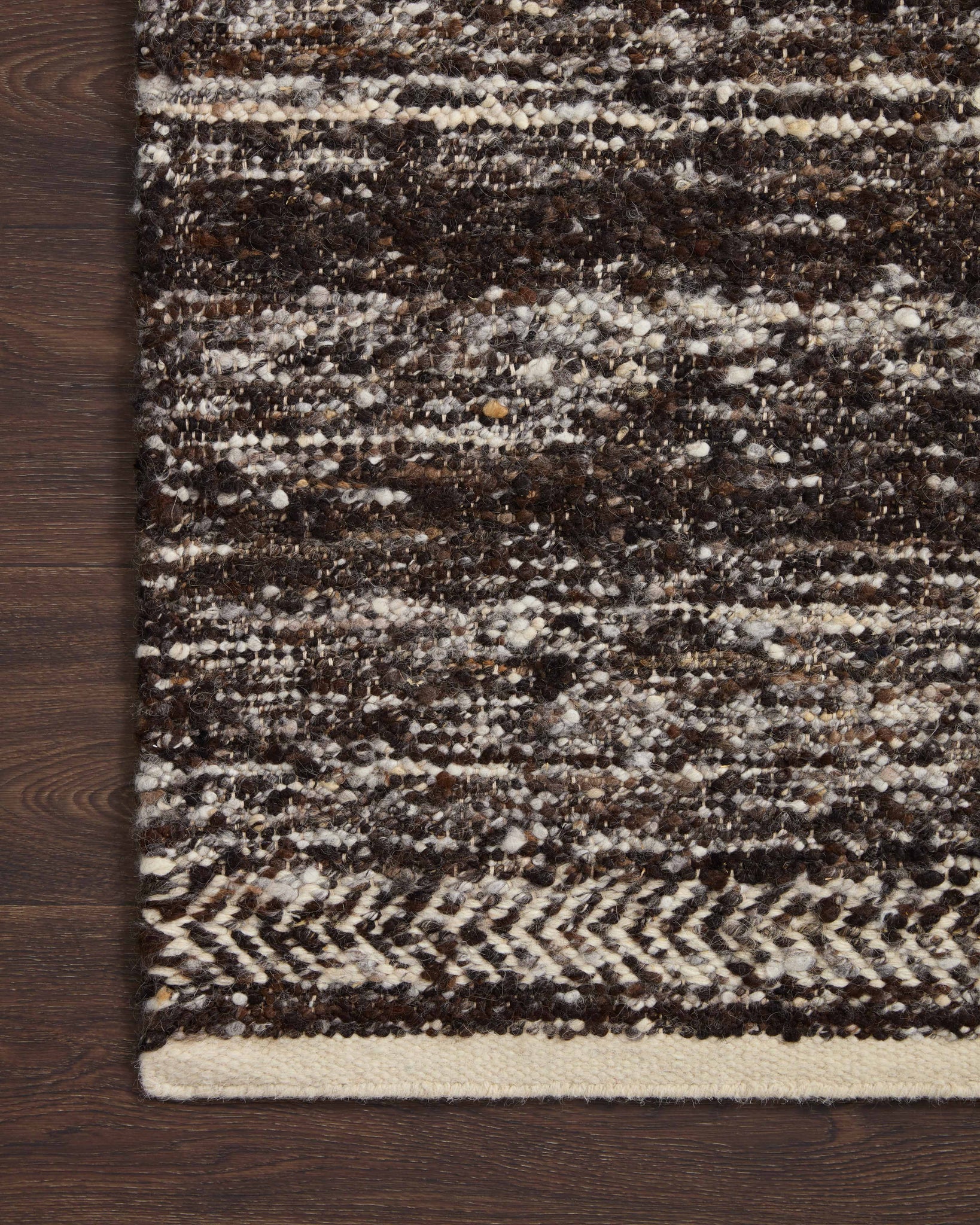 Side view of the Reyla Mocha / Ivory rug.
