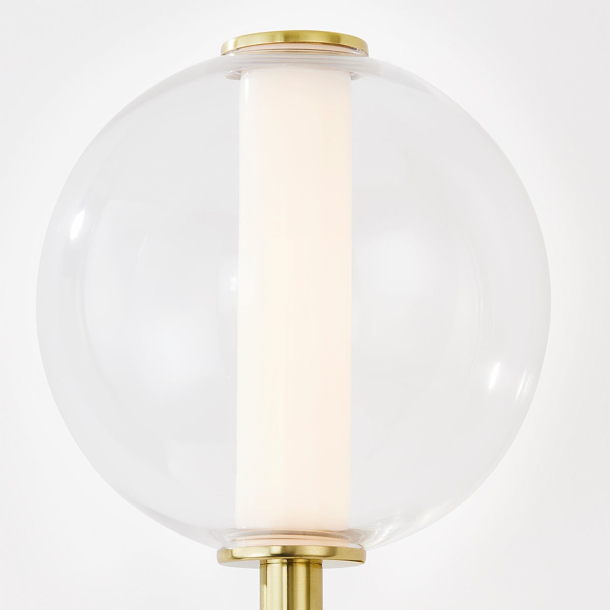 Richford Wall Sconce in aged brass shown from the front to reveal the arm curve and shade silhouette.