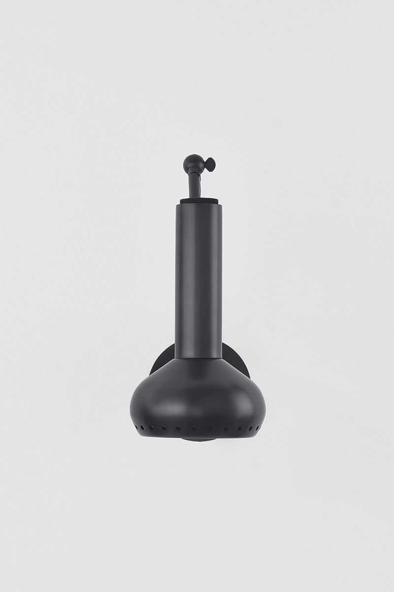 Close-up of the Roald Wall Sconce in dark bronze showing the arm curve and shade silhouette.