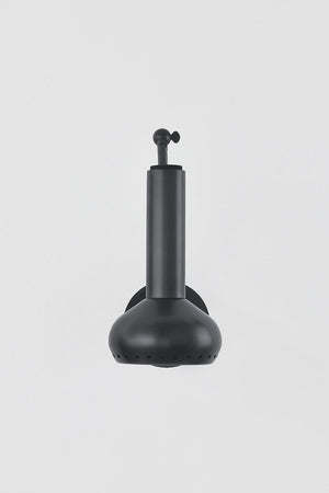 Close-up of the Roald Wall Sconce in dark bronze showing the arm curve and shade silhouette.