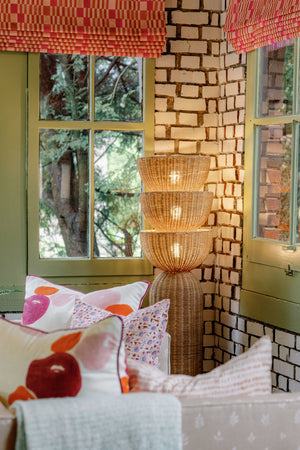 Rian Floor Lamp styled in a reading nook for warm, layered light at Laurie Yapp Home.