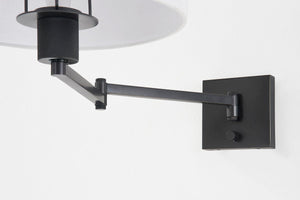 Close-up of the Sammy Wall Sconce in bronze showing the arm curve and shade silhouette.