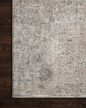Sienne Ivory / Pebble styled underfoot in a layered living room at Laurie Yapp Home.