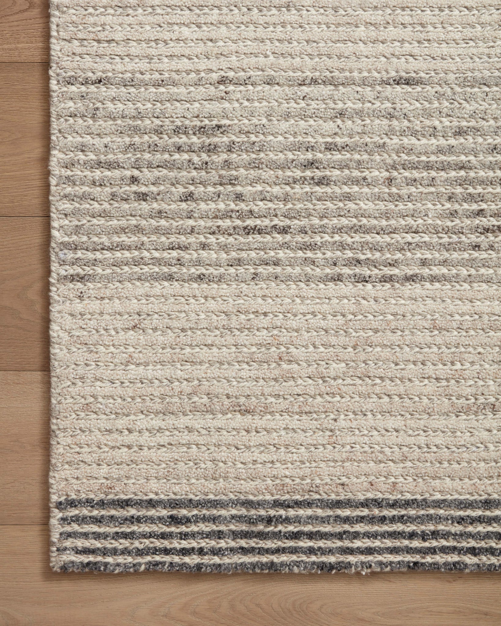 Side view of the Stiles Dove / Ink rug.