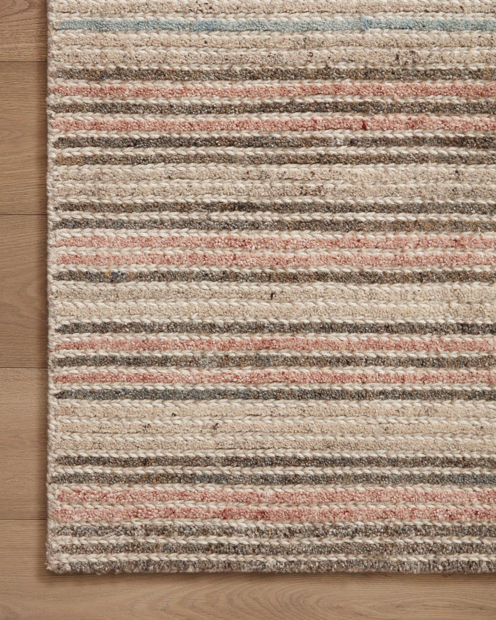 Side view of the Stiles Beige / Multi rug.