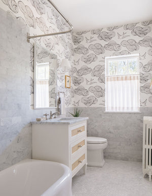 Signature No.1 Wall Sconce 8" x 11.25" in White styled in a warmly lit hallway for warm, layered light at Laurie Yapp Home.