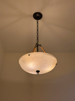 Somerset Pendant in dark bronze styled in a welcoming entryway for warm, layered light at Laurie Yapp Home.
