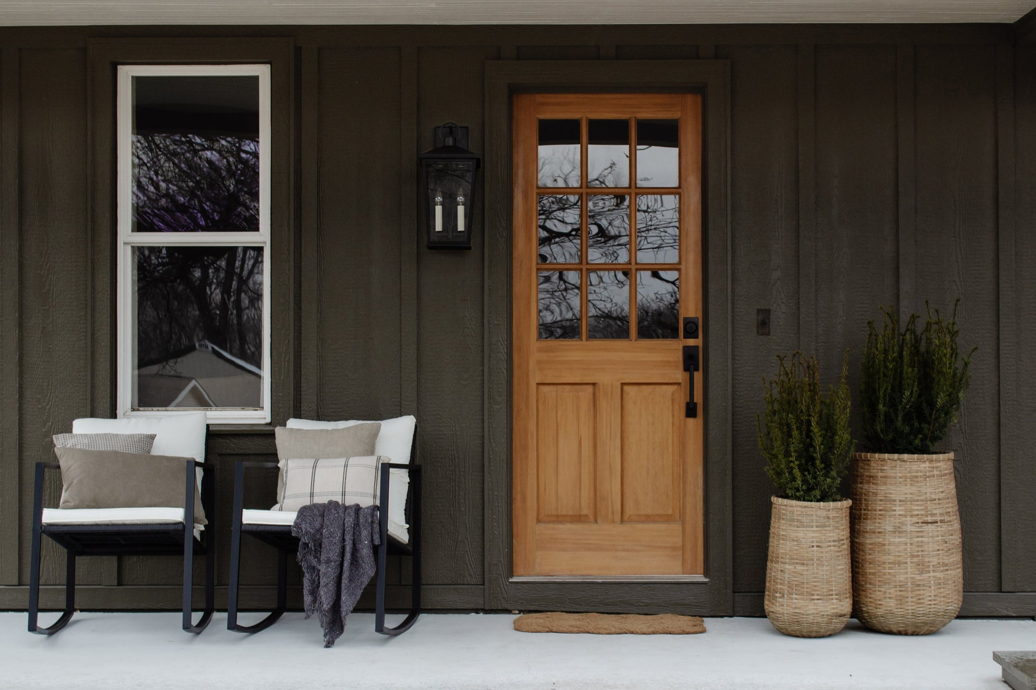Soren Exterior Wall Sconce 9.5" x 20" styled in a curated living room for warm, layered light at Laurie Yapp Home.
