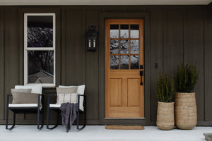 Soren Exterior Wall Sconce 9.5" x 20" styled in a curated living room for warm, layered light at Laurie Yapp Home.