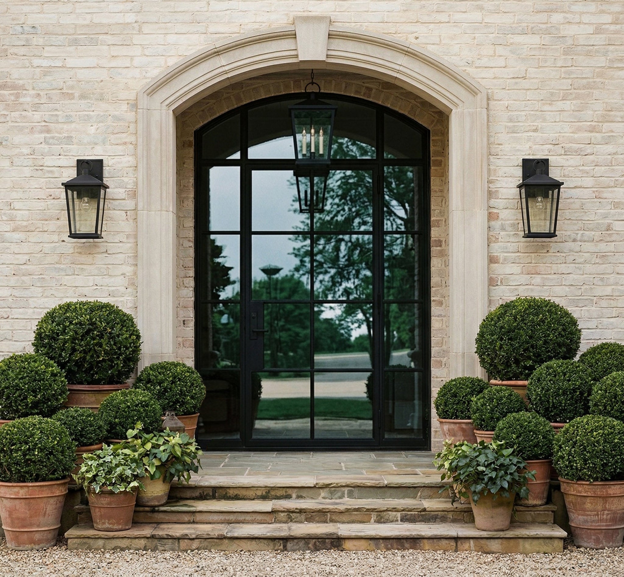 Soren Exterior Wall Sconce 7.5" x 14" styled in a curated living room for warm, layered light at Laurie Yapp Home.