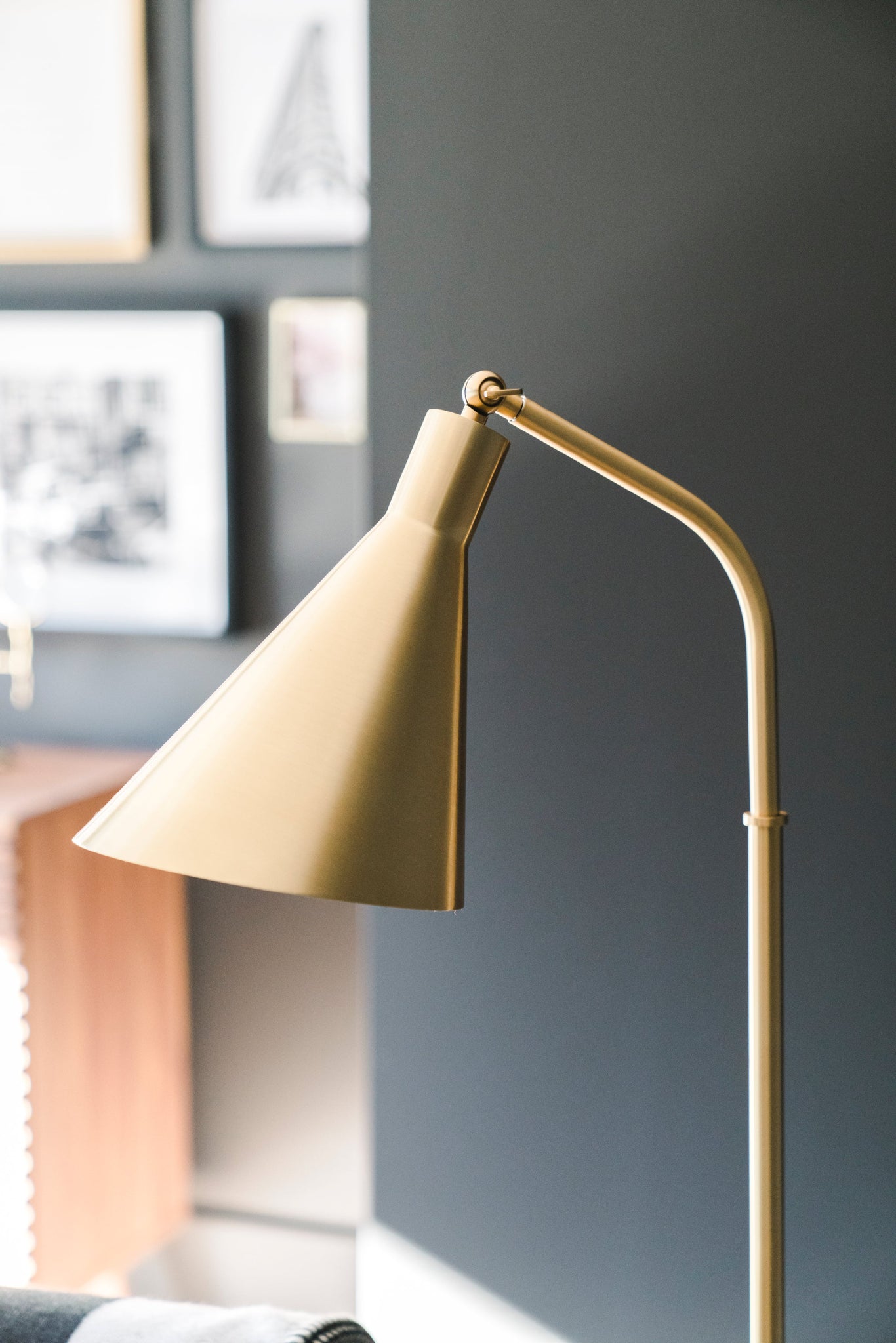 Stanton Floor Lamp in aged brass shown from the front to reveal the stem, base, and shade proportions.