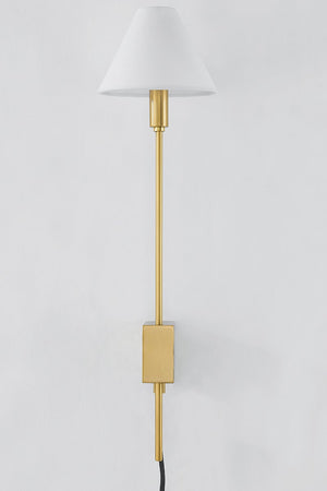 Teaneck Plug-In Sconce in aged brass shown from a second angle to highlight the arm profile and shade silhouette.