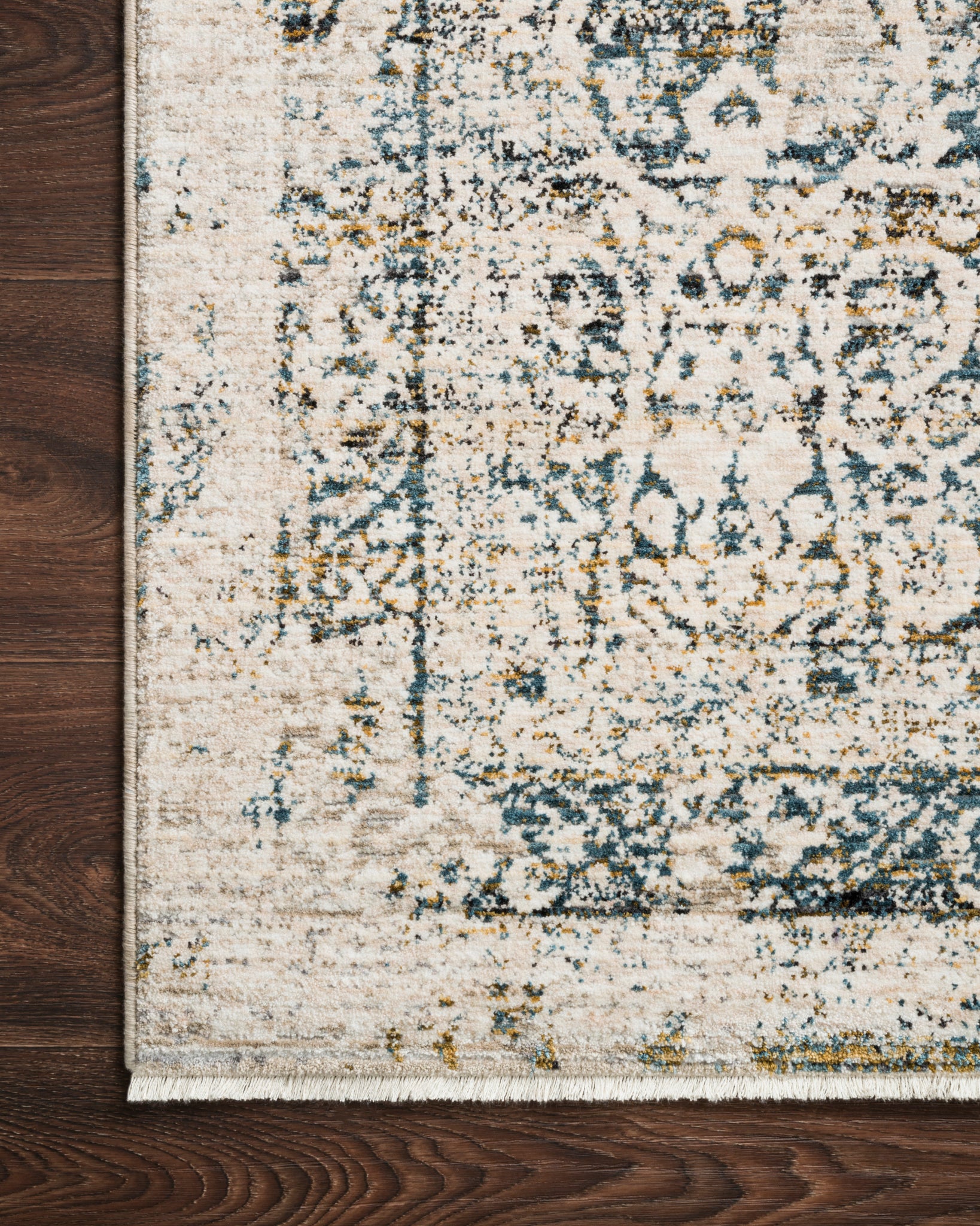 Side view of the Theia Natural / Ocean rug.