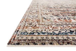 Side view of the Theia Taupe / Brick rug.