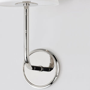 Trice Wall Sconce in polished nickel shown from the front to reveal the arm curve and shade silhouette.