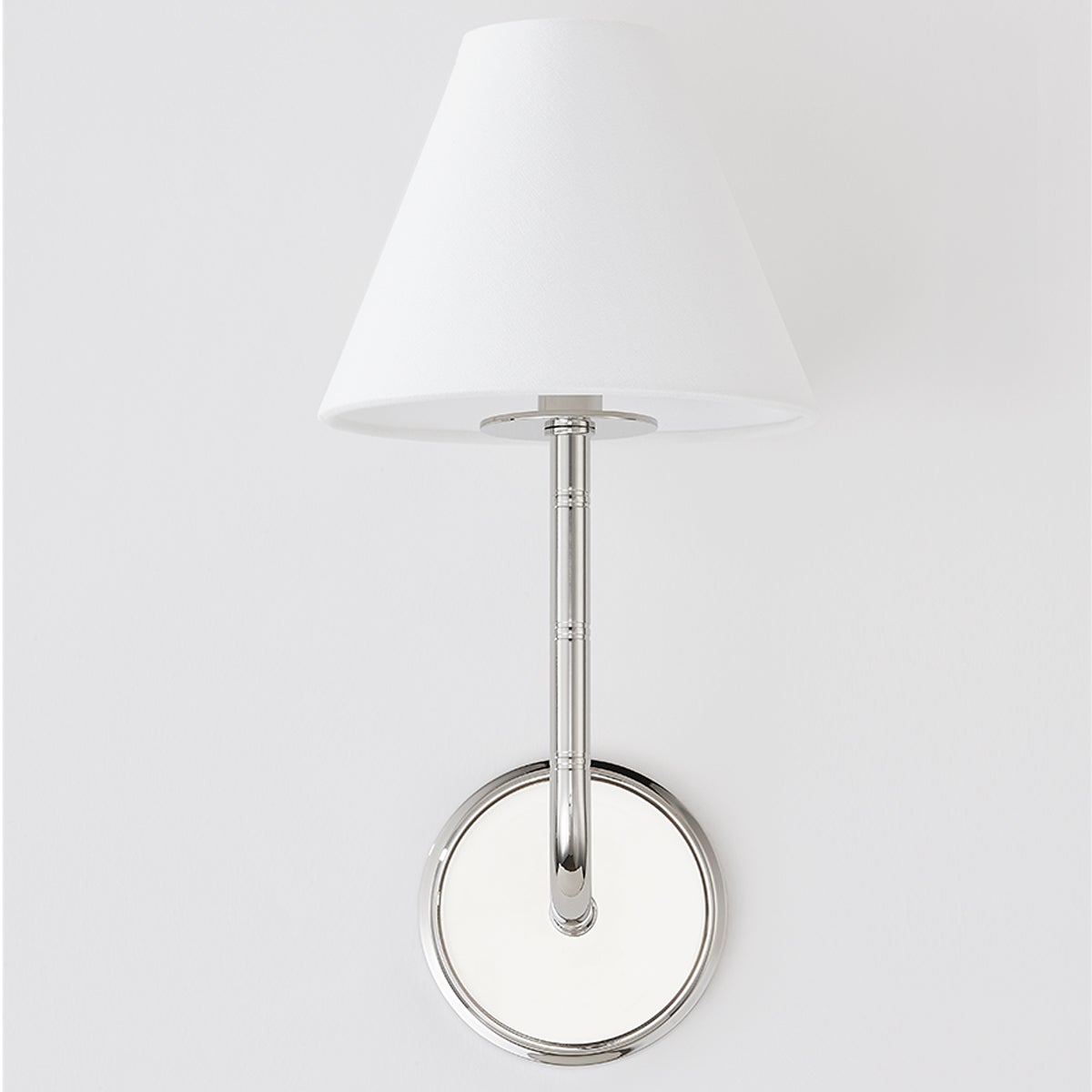 Close-up of the Trice Wall Sconce in polished nickel showing the arm curve and shade silhouette.