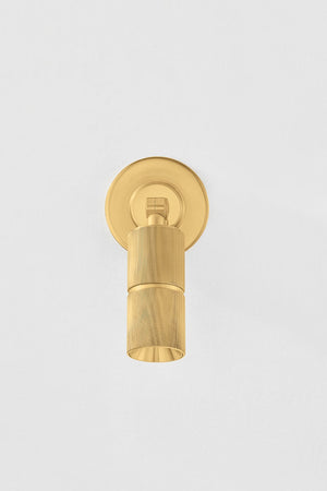 Truett Wall Sconce in aged brass shown from the front to reveal the arm curve and shade silhouette.