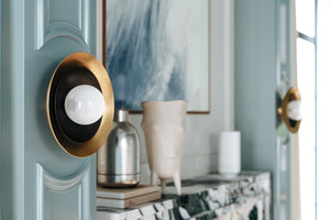 Close-up of the Tobia Wall Sconce showing the arm curve and shade silhouette.